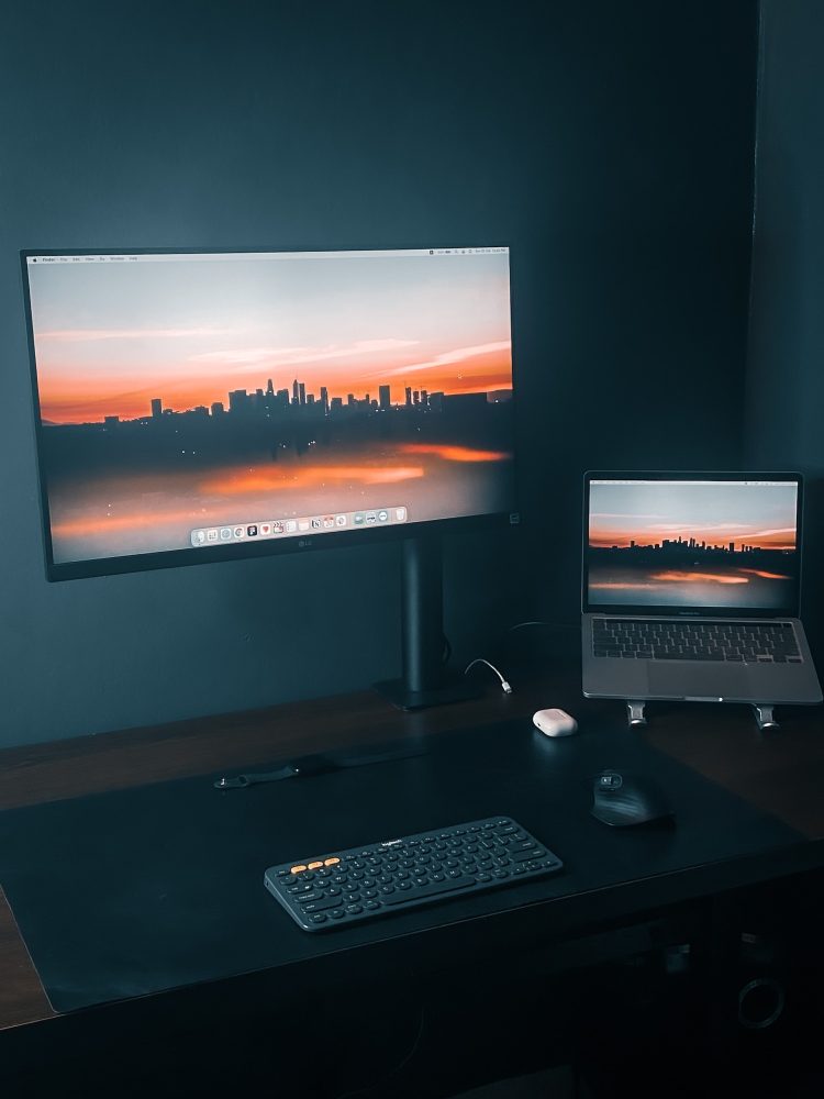 lg tv and a laptop on a table
