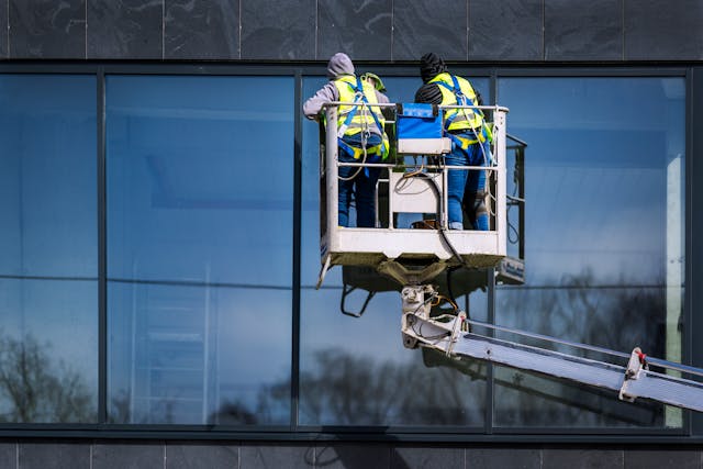 men-cleaning-skyscraper-windows